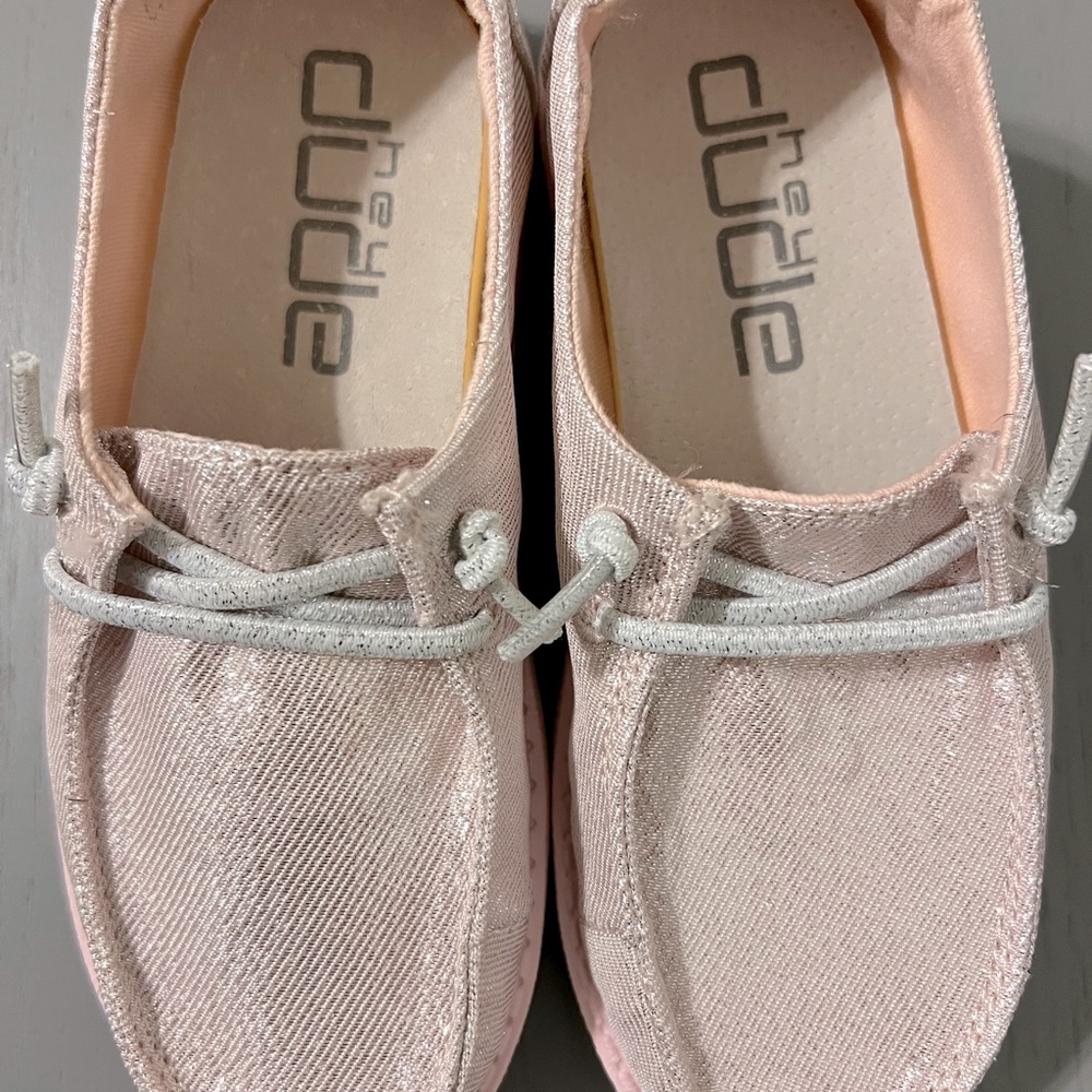 Hey Dudes shiny pink girls. Never worn. Have box.